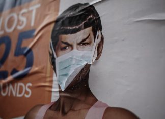 Pandemica woman in white tank top wearing face mask