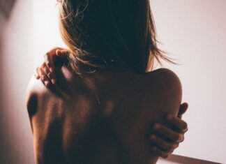 Poison Sumac close photo of woman's back